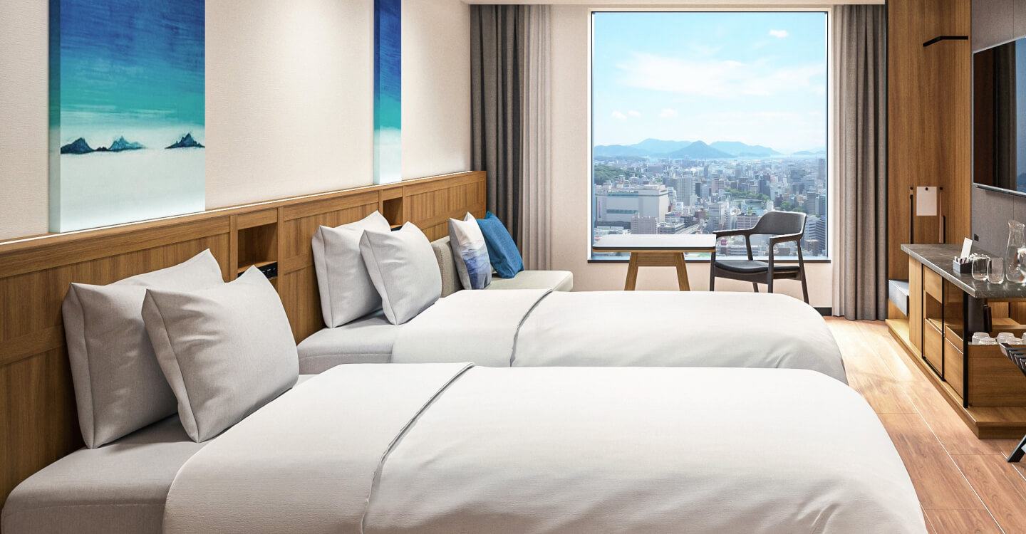 Photo: Twin-bedded room. There is a large window at the back of the room with a panoramic view of the scenery.